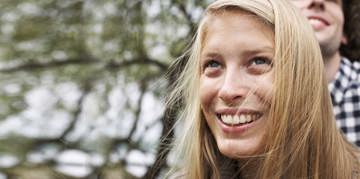 Blonde woman smiling.