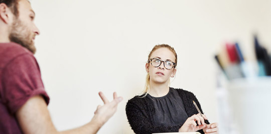 Man and woman brainstorming.