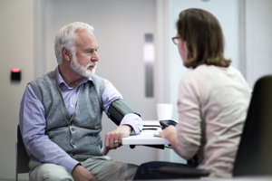 Man getting checked up by a doctor