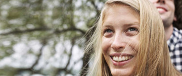 A woman looking up with a smile