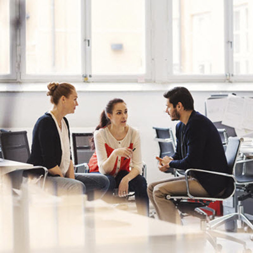 People having a meeting in an office
