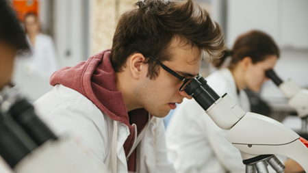 Man using a microscope