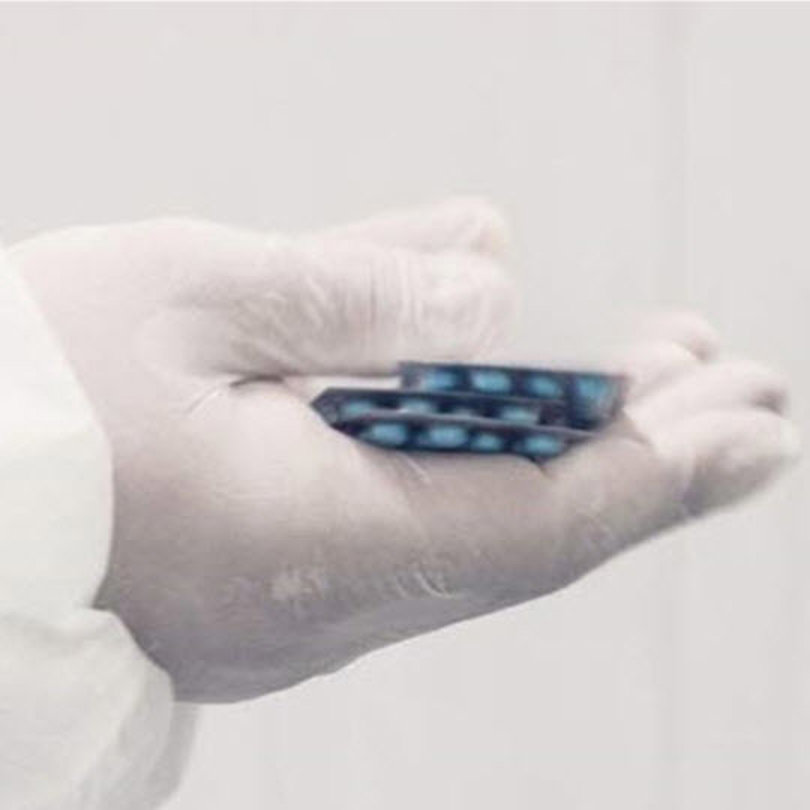 Hand holding pills.