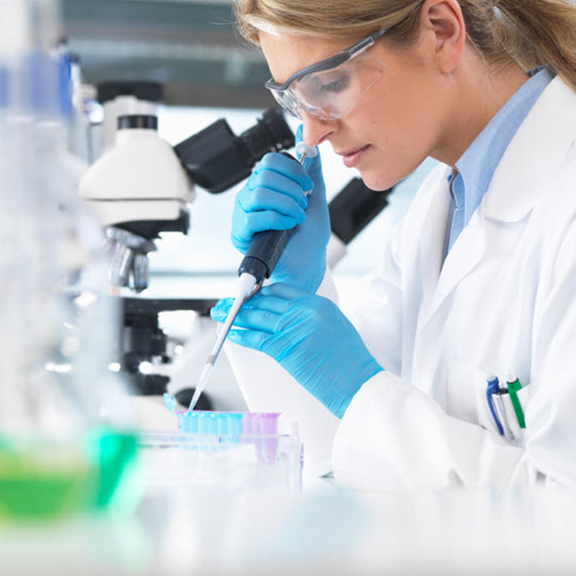 Scientist filling some tubes
