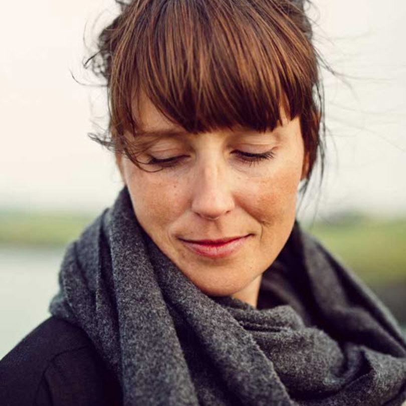 Woman wearing a scarf.