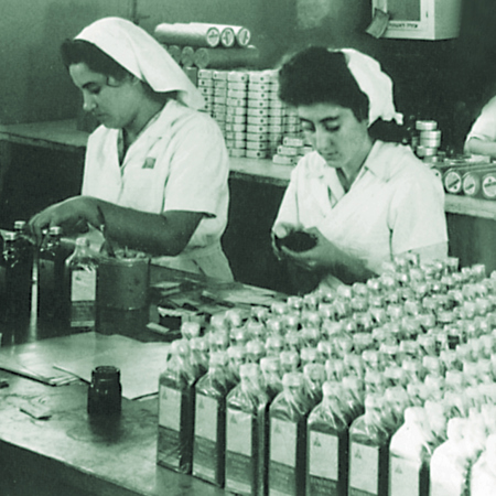 Two women working in a factory.