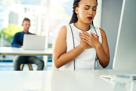 Woman holding her heart
