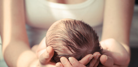 Mother holding her baby.